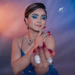 For those who love a pop of color, this look is perfect. I created a bold blue smokey eye, paired with a nude lip, to complement this stunning blue gown and diamond jewellery.
