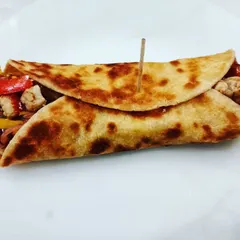 Who says healthy food can't be delicious? This is a healthy tortilla wrap, packed with colorful veggies and lean protein. It's a perfect example of a balanced, tasty, and quick meal that you can easily make at home.