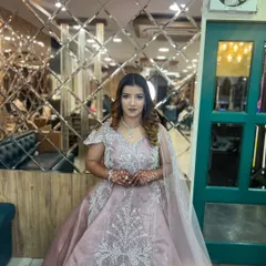 A full-length view of the engagement gown look. The makeup and hair perfectly complement the heavily embellished dress, creating a balanced and elegant appearance.