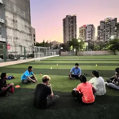 As the sun sets, we cool down and reflect. These group discussions are vital for building a strong team bond and ensuring every boxer understands the 'why' behind their training.