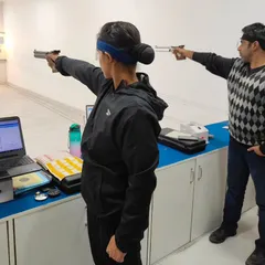 Two of our pistol shooters training side by side, with one using a SCATT electronic training system. This technology provides real time feedback on aim and trigger control, helping to refine skills.