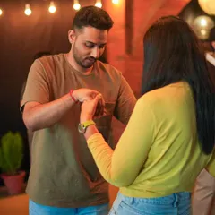 It all starts with learning to connect through your hands and movement. This image captures a moment of instruction where a student is learning the basics of leading in a partner dance, essential for a confident first dance.
