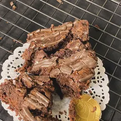 A close-up of our decadent brownie pieces, showing the rich texture and generous chocolate chunks inside.