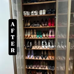 After: A stunning shoe closet transformation. We organized this collection by type and color, placing heels and formal wear on display in a beautiful glass-front cabinet.
