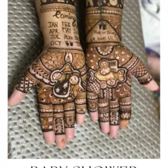 'Pink or Blue, We Love You'. A very cute baby shower mehendi with a calendar marking the due date and adorable baby motifs.