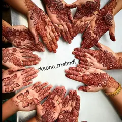 A beautiful moment of celebration, with all the hands of the family and friends coming together. I created a variety of coordinated Arabic and butterfly designs for the bride's squad.
