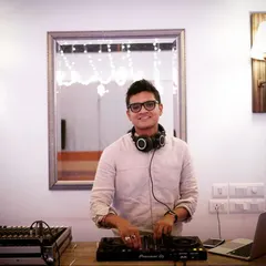 Here I am in my element, behind my Pioneer DJ setup. I believe a great DJ is approachable and focused, ready to read the room and create the perfect atmosphere for any occasion, be it a wedding or a corporate party.
