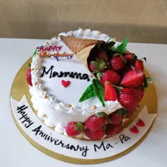 When strawberries are in season, I love making cakes that let the fruit be the star. This anniversary and birthday cake features a cone overflowing with fresh, juicy strawberries.