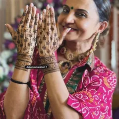 It's not just for brides! A happy client showing off her elegant and simple lotus-stem mehandi, perfect for any festive occasion.