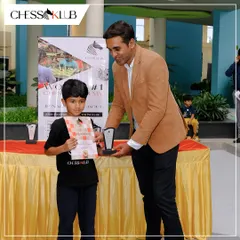 A moment of recognition for one of our young players at the Chess Carnival 2024. Receiving an award on stage builds confidence and rewards the hard work put into every practice session and game analysis.