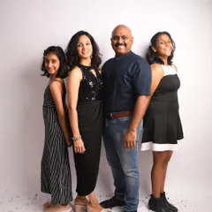 A simple and beautiful standing portrait of the whole family. Coordinated outfits can make a big impact, creating a cohesive and polished look for your family photos.