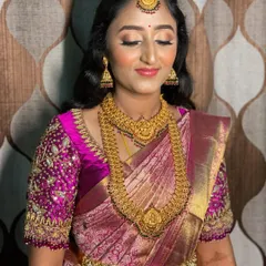 A close-up of Vidya's reception makeup. The focus is on luminous skin and soft, shimmery eyes, creating a look that is both glamorous and elegant.