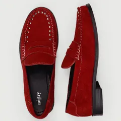 A top-down view of the crimson suede loafers with delicate stud detailing along the moc-toe stitching. This design combines a bold color with subtle embellishment for a balanced, statement-making shoe.