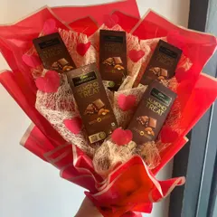A hand-held view of our chocolate bouquet. It's a fun and delicious alternative to traditional flowers, perfect for any occasion.
