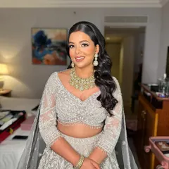 A full portrait of Shreya, looking elegant and poised. The makeup is sophisticated and timeless.