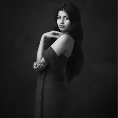 The black and white version of the elegant fine art portrait. Monochrome enhances the mood, the texture, and the subject's compelling gaze.