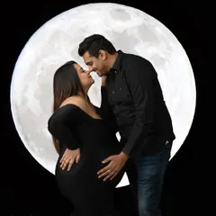 To the moon and back. This romantic portrait uses my custom moon prop to create a magical, dreamy setting for couples to celebrate their journey together under the stars.