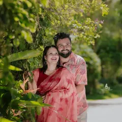 A happy, laughing embrace among the tropical plants. The genuine joy in this photo is contagious.