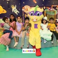 Nothing makes us happier than seeing these smiles! Our friendly mascot, Super K, loves joining the party to give hugs, pose for photos, and make your child's day extra special.