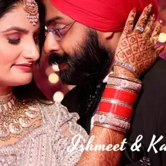 An intimate close-up of a Sikh couple during their reception. The focus is on the bride's beautiful henna and chooda as she embraces her partner, showcasing the rich traditions and emotions of a Punjabi wedding.