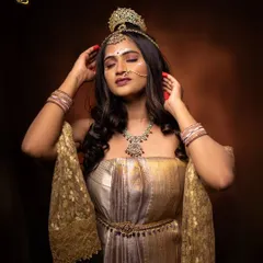 A powerful pose as Shailaputri, adjusting her crown. This is a metaphor for women adjusting to their own power and embracing their inner strength with grace.