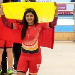 As a coach and a competitor, I lead by example. Here I am, proudly holding the Karnataka flag after competing. I bring the same passion and discipline from my own races to every single training session with my students.