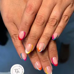 Why choose one color when you can have them all? This playful rainbow French manicure features a different bright color on each tip for a fun and vibrant look.