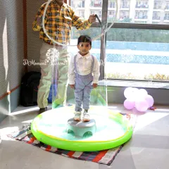 The giant bubble activity is a magical experience for kids, allowing them to be enclosed in a massive soap bubble for a one-of-a-kind photo.