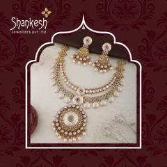 A modern classic, this necklace set combines gold, pearls, and coin-like elements for a sophisticated and elegant look that appeals to a wide audience.
