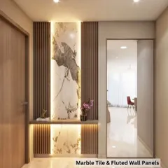 See how beautifully our materials come together in a real home. This entryway uses a combination of a backlit marble-finish tile and wooden fluted wall panels to create a warm, luxurious welcome. We can help you design a similar look for your space.