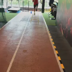 A client works on his speed and footwork with ladder drills on our track.