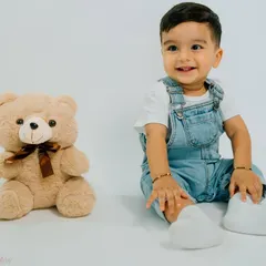 A boy and his best friend. This simple, classic portrait with a teddy bear is a timeless memory of childhood companionship.