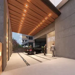 The covered drop-off and entrance area of the AURA Sky Tower. We designed this space for a seamless and impressive arrival experience, featuring a warm wood-paneled ceiling, integrated lighting, and direct access to the main lobby.