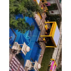 An aerial view of a vibrant poolside Haldi ceremony. My drone can capture the entire layout of your daytime events, from the decor and seating to the guests enjoying the function.