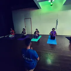 Guiding my students through a seated meditation at the beginning of class. We start by centering ourselves and setting an intention for our practice.