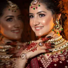 A creative shot with a reflection, showing the bride's happy expression. Capturing these joyful moments is one of the best parts of my job.
