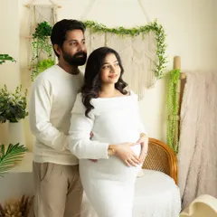 A classic standing pose for a couple's maternity portrait. I direct clients to look towards the light, creating a hopeful and forward-looking mood.