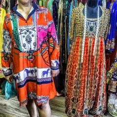 I love creating customized wardrobes for my clients. This client is wearing a vibrant, custom-stitched shirt dress that fits her perfectly. You can bring your own fabrics or choose from my boutique's collection to get your dream outfit made.