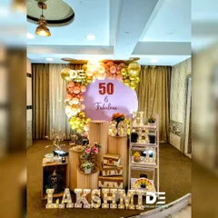 Celebrating a big milestone should be stylish and personal. For this '50 & Fabulous' party, I designed a chic setup with a custom backdrop, an elegant gold and rose-gold balloon arch, and personalized marquee letters to honor the special occasion.