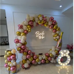 A wider view of the circular balloon arch setup, showing how it creates a fantastic focal point for the party in any room.