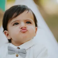 That sweet little pout is everything. For this outdoor first birthday session, we created a simple boho picnic setup that let his adorable personality take center stage.