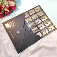 This unique card features 15 mini golden envelopes, each holding a tiny, personal message. It's an interactive and heartfelt way to say "I love you" for Valentine's Day or an anniversary.