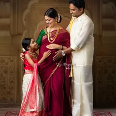 Awaiting the new arrival with love. This elegant, traditionally styled maternity portrait includes the whole family, celebrating the anticipation and the bond you already share.