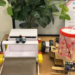 A view of the prototypes for the river cleaning robot and firefighting robot. These models are built with accessible materials and electronics like Arduino, demonstrating our focus on hands-on building.
