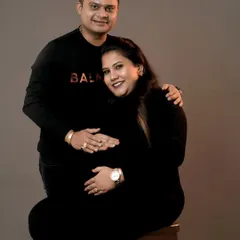 A classic and loving pose for an expecting couple in our studio. We focus on creating a comfortable atmosphere where you can relax and let your connection shine through.