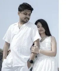 A portrait from a pre-wedding shoot with the couple dressed in all white, creating a serene and classic look.