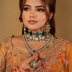 This shot focuses on the intricate jewellery and the perfectly manicured nails, showing my attention to every detail of the final look.