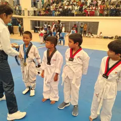 A proud moment for these young champions as they receive their medals at a local Taekwondo tournament. Their focus and determination are inspiring.