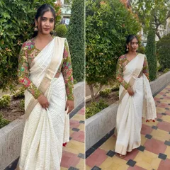 A full look at this beautiful off-white striped saree with a gold border. I've paired it with a contrast printed blouse to show how a simple saree can be elevated with the right blouse. It's a perfect mix of traditional and chic.