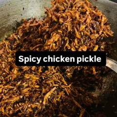 A fresh batch of my spicy shredded chicken pickle is available. It's a versatile condiment that adds a fiery kick to any dish.